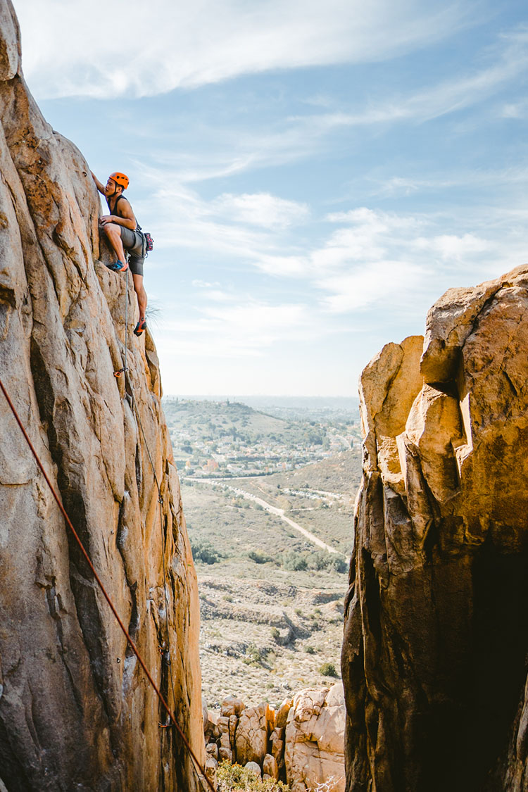 Rock climber at top of rock face in Mission Trails Regional Park